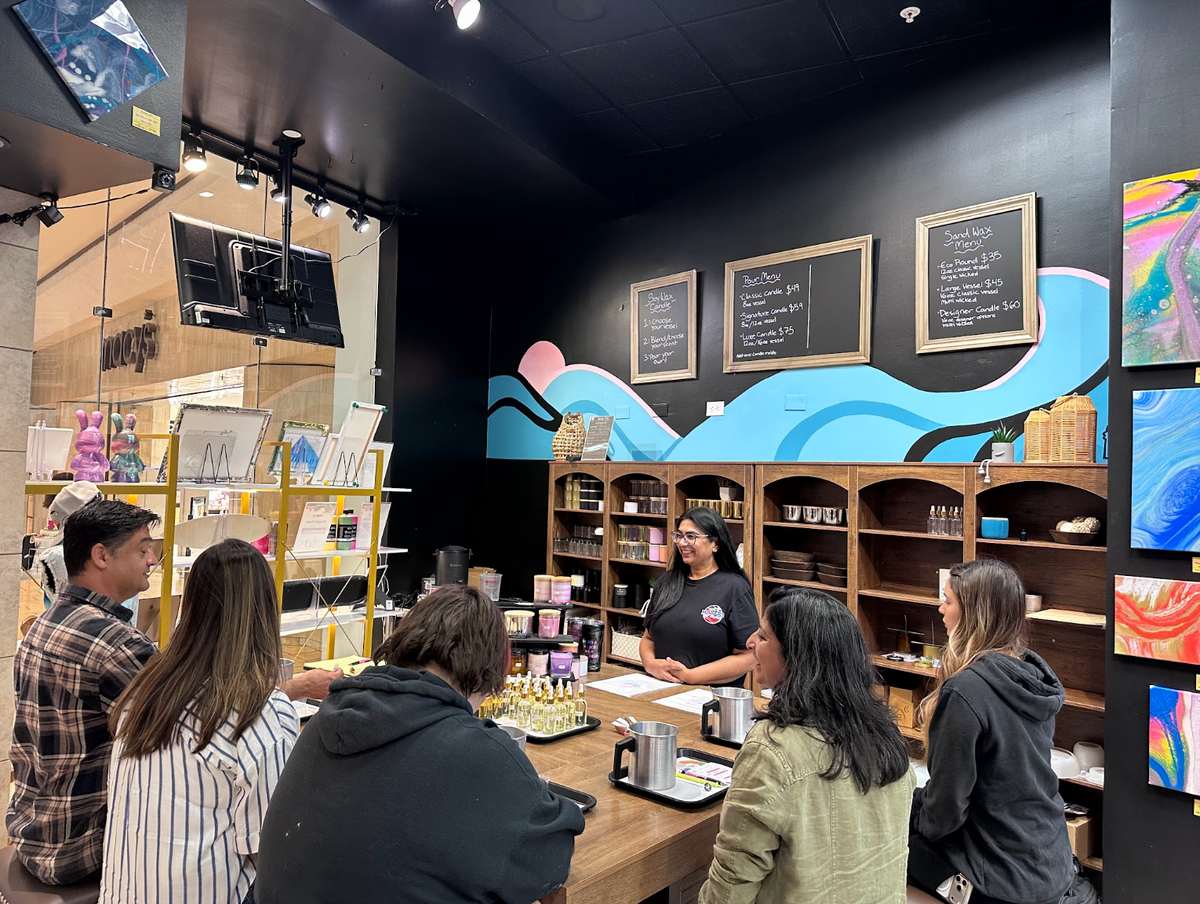 Guests at a candle making class during the Sunset Tide Candle Bar in Pleasanton