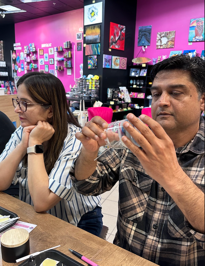 Guests inspecting candle vessels at Dad's Candle Bar Father's Day workshop in Pleasanton
