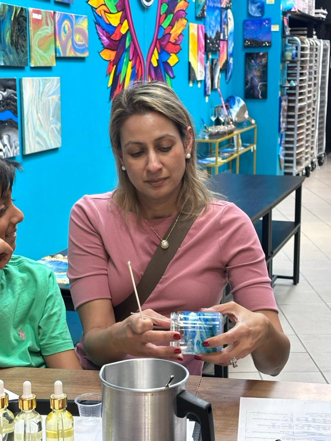 Guest blending a custom fragrance at the Sunset Tide scent bar