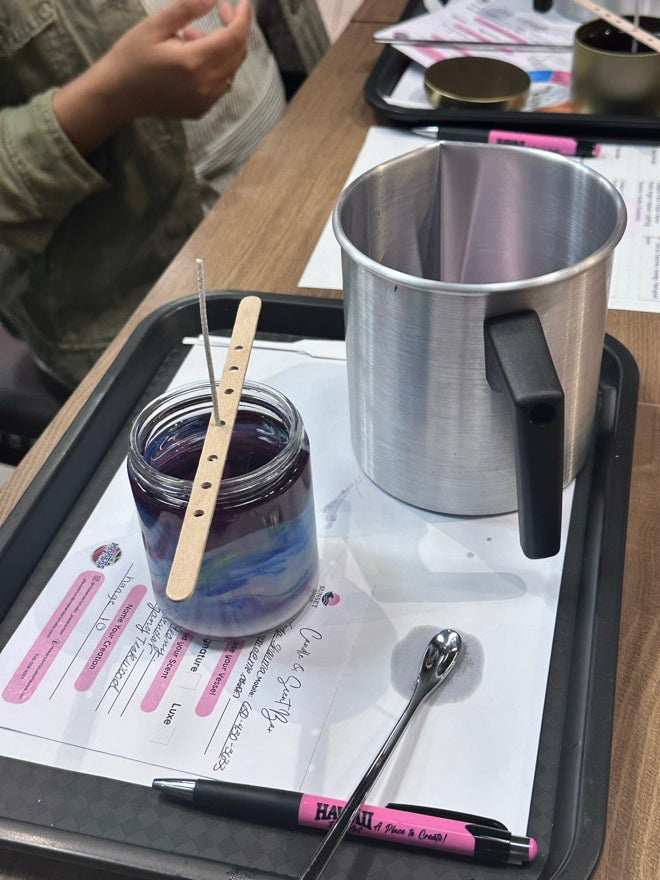 Soy candle making in Pleasanton — pouring premium soy wax into a vessel