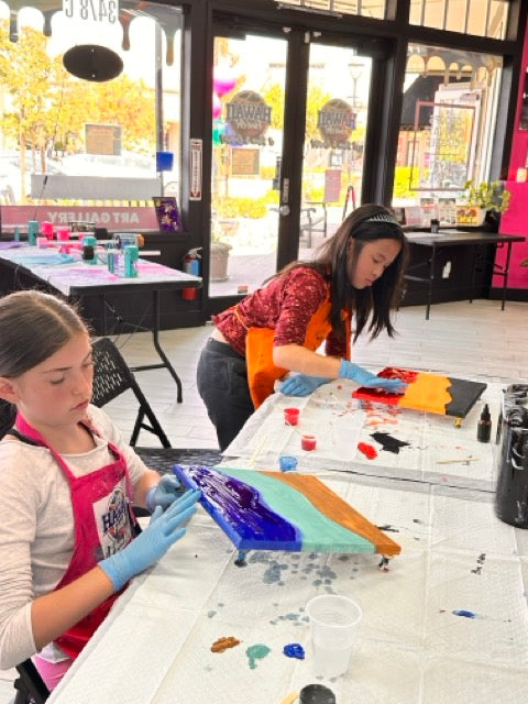 Two campers working on advanced resin beach scenes