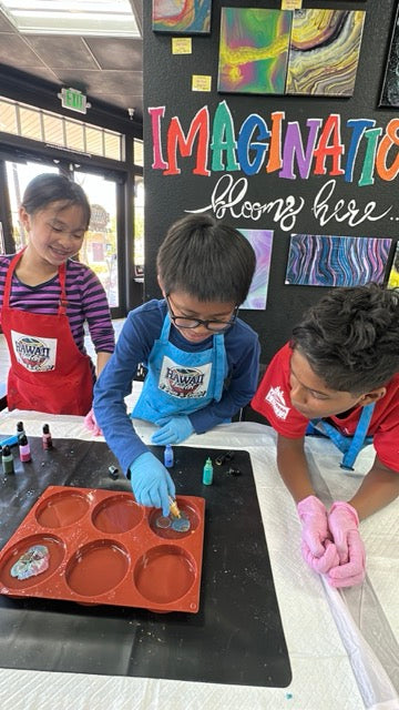 Kids making resin coasters as a supplemental activity