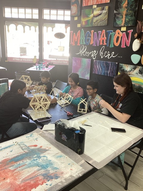 Campers and instructor relaxing at the studio during camp