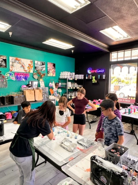 Kids working at studio tables during camp