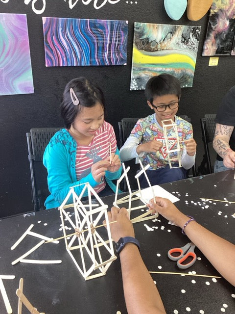 Kids working on a supplemental craft activity